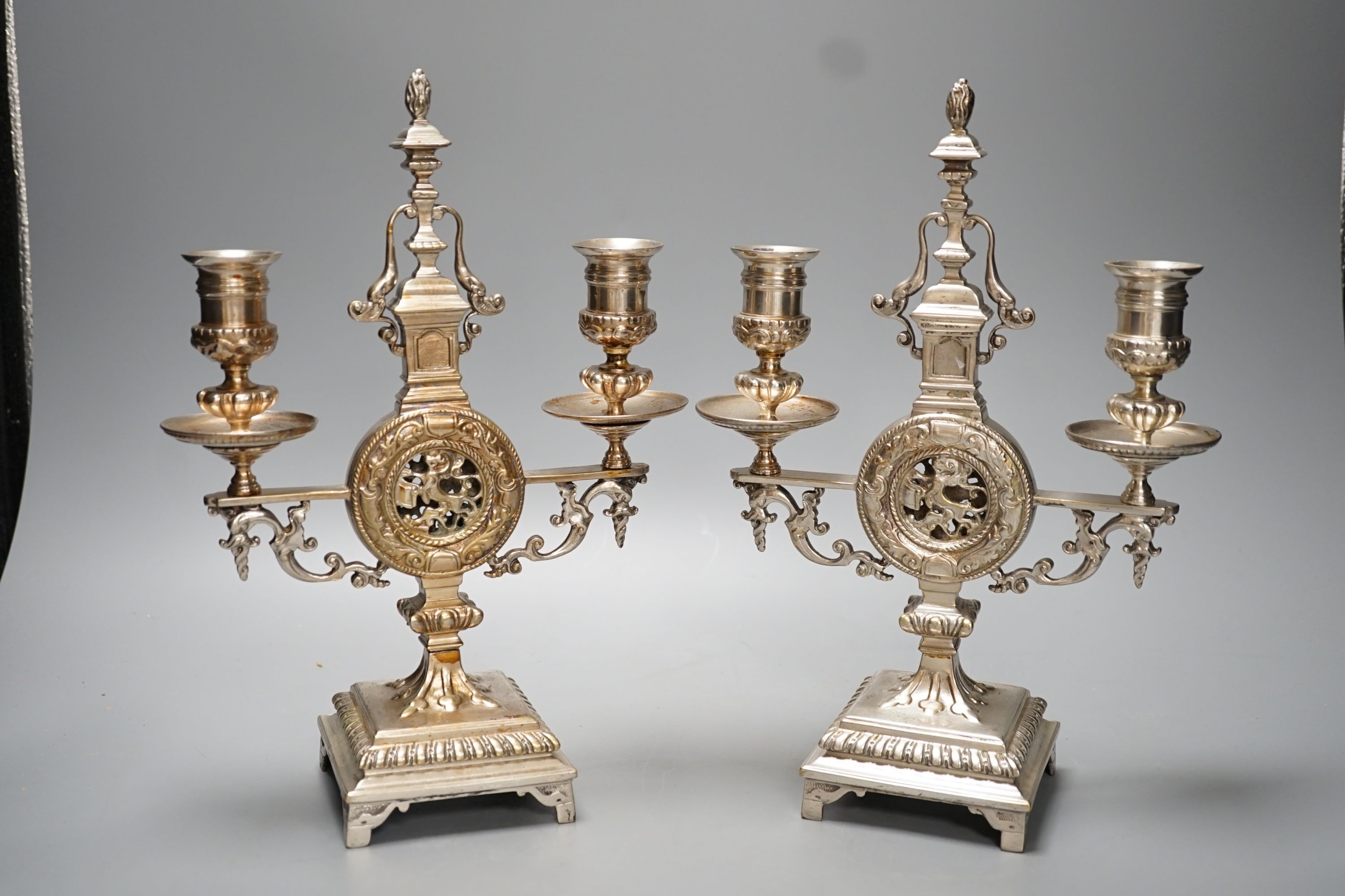 A pair of Winn & Co., Birmingham silvered brass two branch candelabra - 28.9cm high